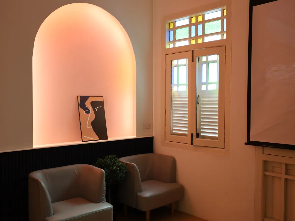 The Loft cozy lounge niche with ambient lighting and artwork